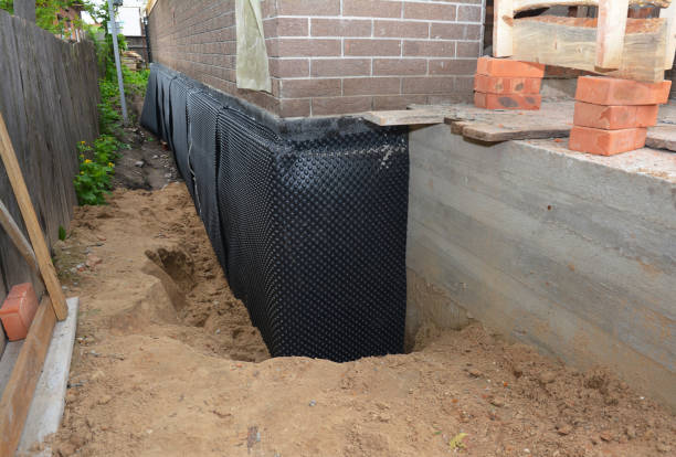 Happy homeowners after waterproofing job in Custar